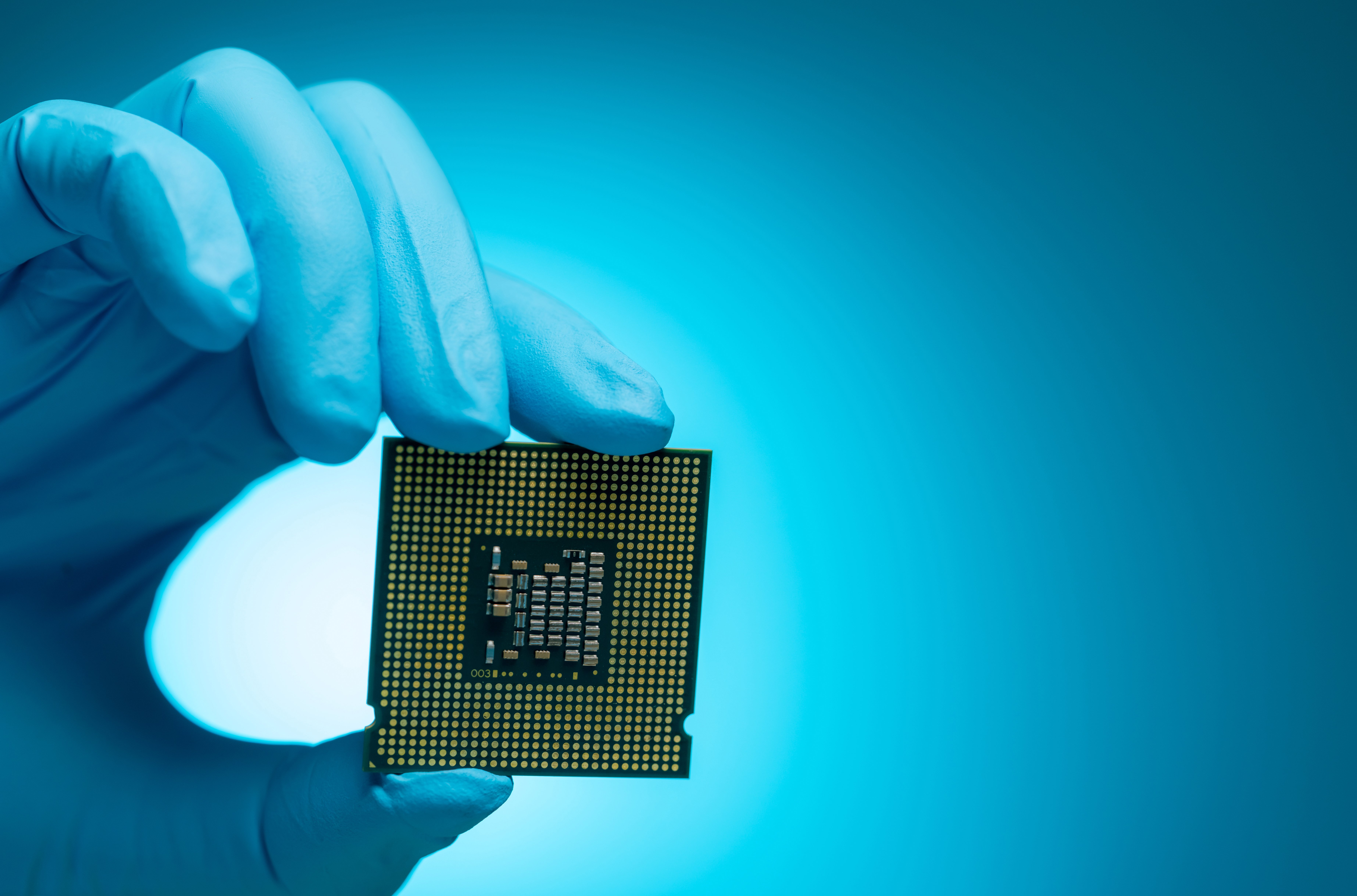 electronic-engineer-hand-holding-computer-chip-on-2025-01-29-04-38-46-utc